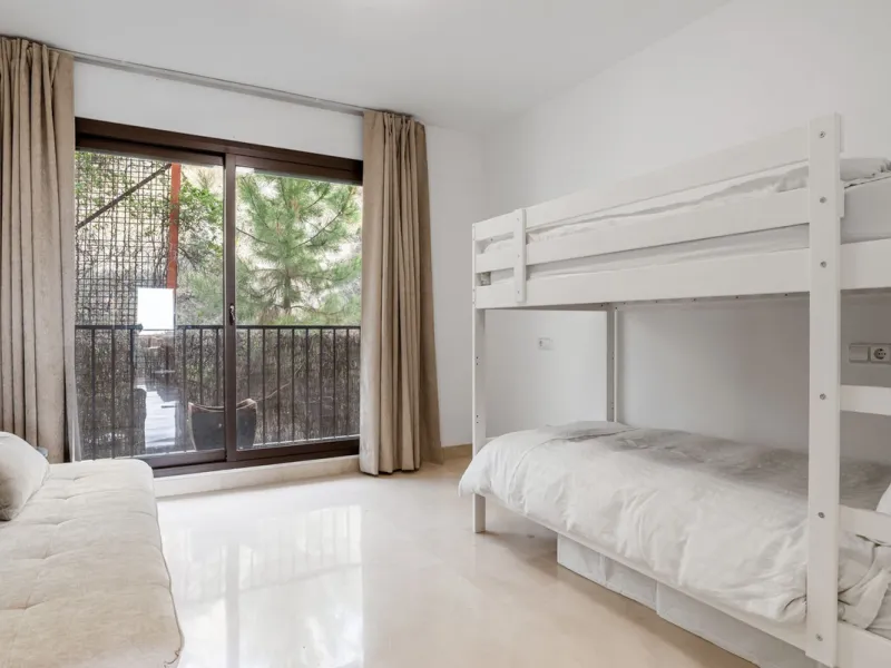 Discover this bright and elegant two bedroom first floor apartment located within the sought after Los Pinos in Los Arqueros Golf and Country Club. Set in a peaceful and secure environment, the property enjoys an elevated position with beautiful open view