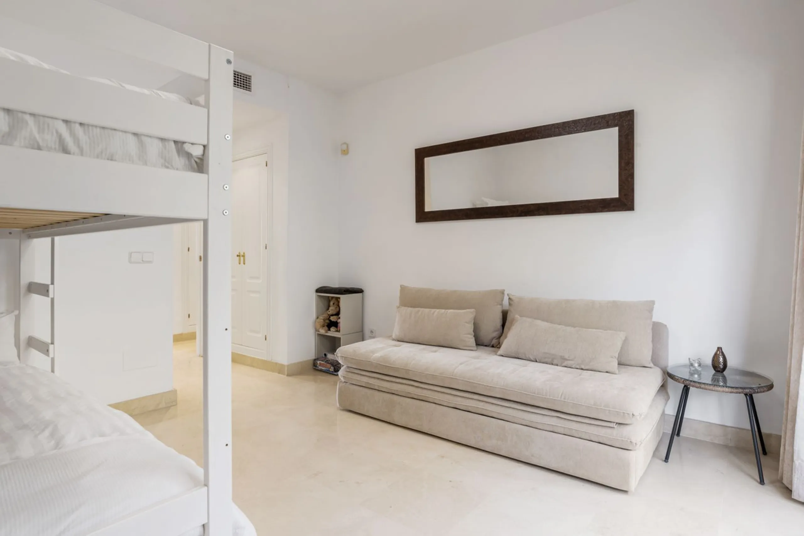 Discover this bright and elegant two bedroom first floor apartment located within the sought after Los Pinos in Los Arqueros Golf and Country Club. Set in a peaceful and secure environment, the property enjoys an elevated position with beautiful open view