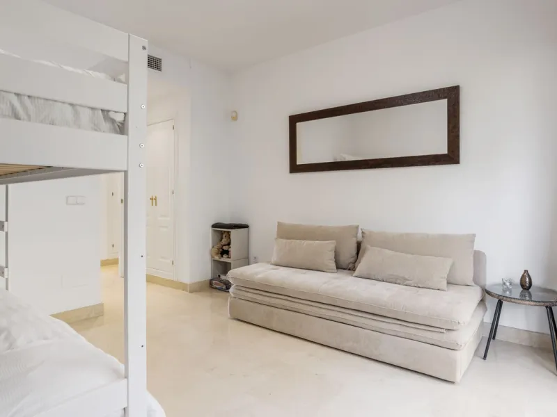 Discover this bright and elegant two bedroom first floor apartment located within the sought after Los Pinos in Los Arqueros Golf and Country Club. Set in a peaceful and secure environment, the property enjoys an elevated position with beautiful open view