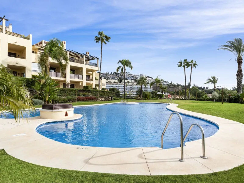 Discover this bright and elegant two bedroom first floor apartment located within the sought after Los Pinos in Los Arqueros Golf and Country Club. Set in a peaceful and secure environment, the property enjoys an elevated position with beautiful open view