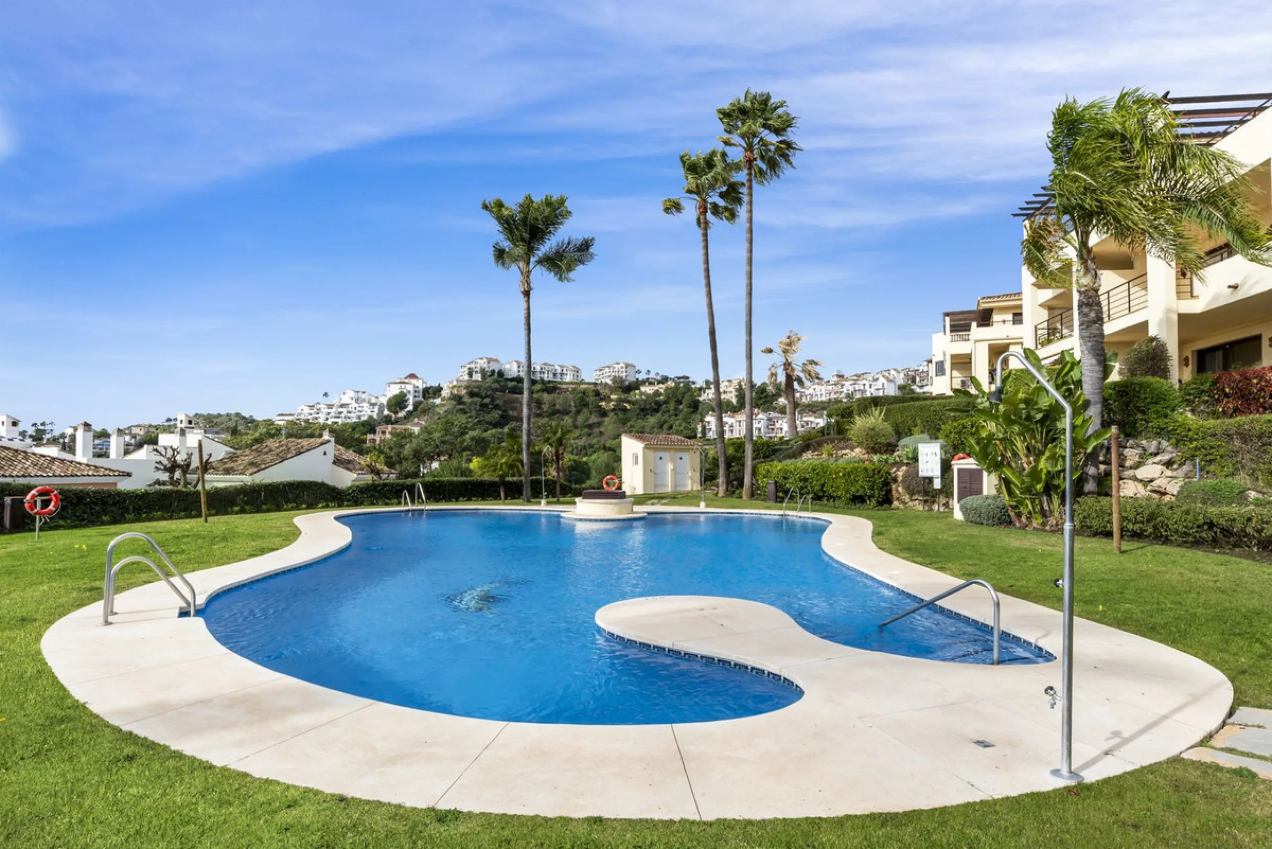 Discover this bright and elegant two bedroom first floor apartment located within the sought after Los Pinos in Los Arqueros Golf and Country Club. Set in a peaceful and secure environment, the property enjoys an elevated position with beautiful open view