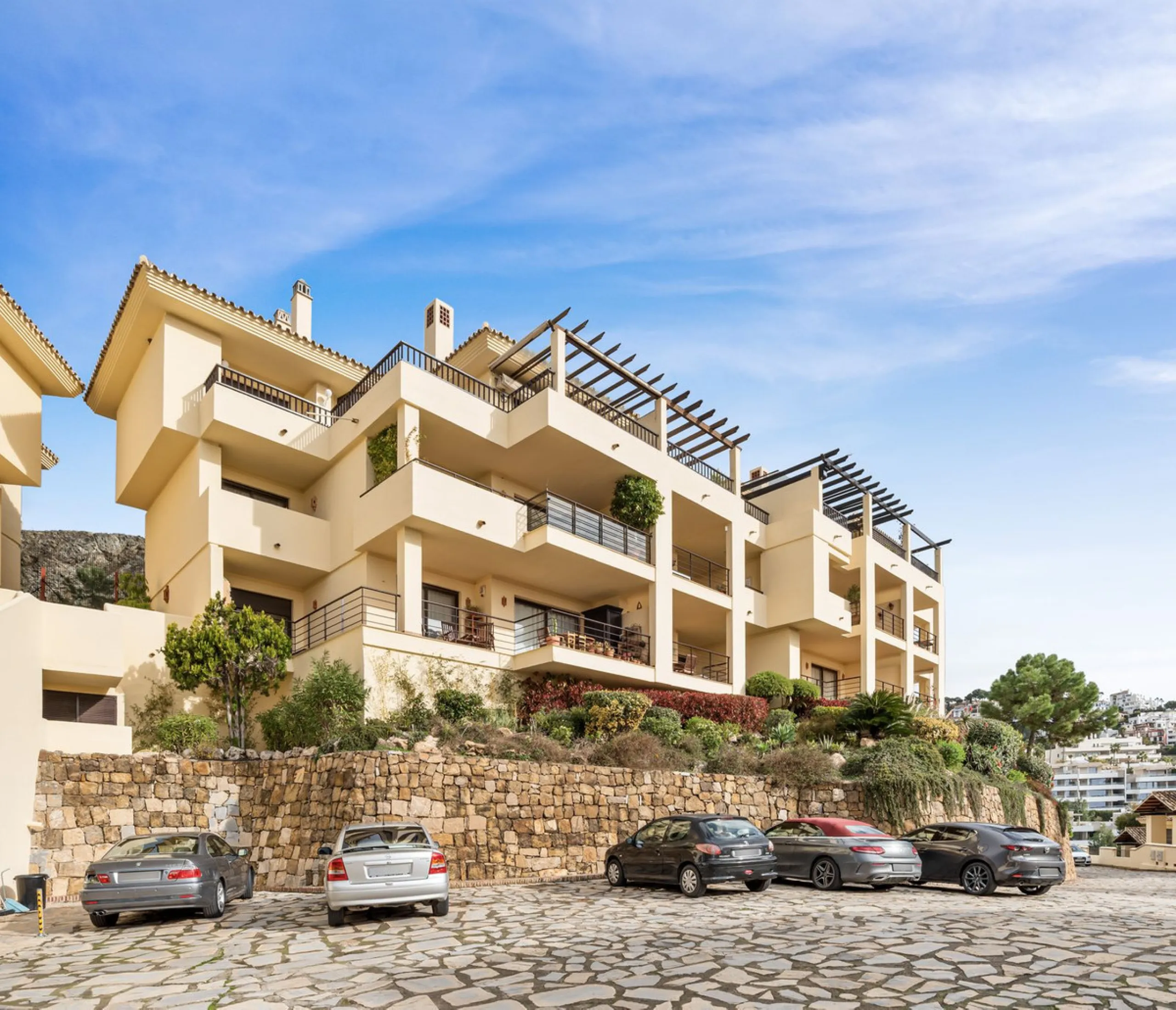 Discover this bright and elegant two bedroom first floor apartment located within the sought after Los Pinos in Los Arqueros Golf and Country Club. Set in a peaceful and secure environment, the property enjoys an elevated position with beautiful open view
