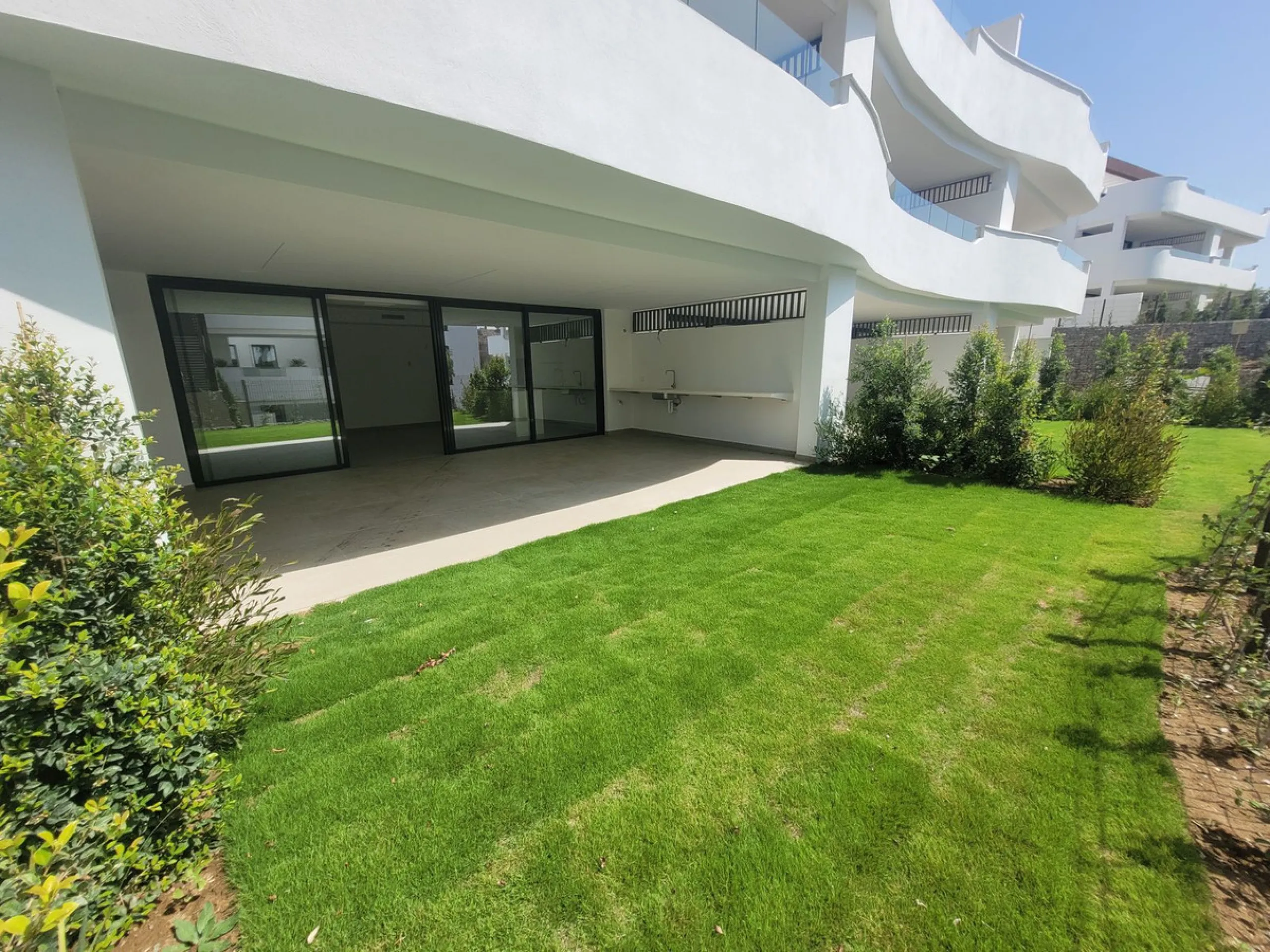 Exclusive ground floor apartment with private garden located in a modern resort-style residential complex in Cancelada, on the prestigious New  Milla de Oro (**Estepona**).