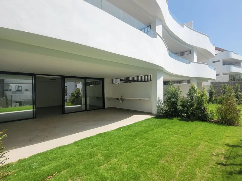 Exclusive ground floor apartment with private garden located in a modern resort-style residential complex in Cancelada, on the prestigious New  Milla de Oro (**Estepona**).