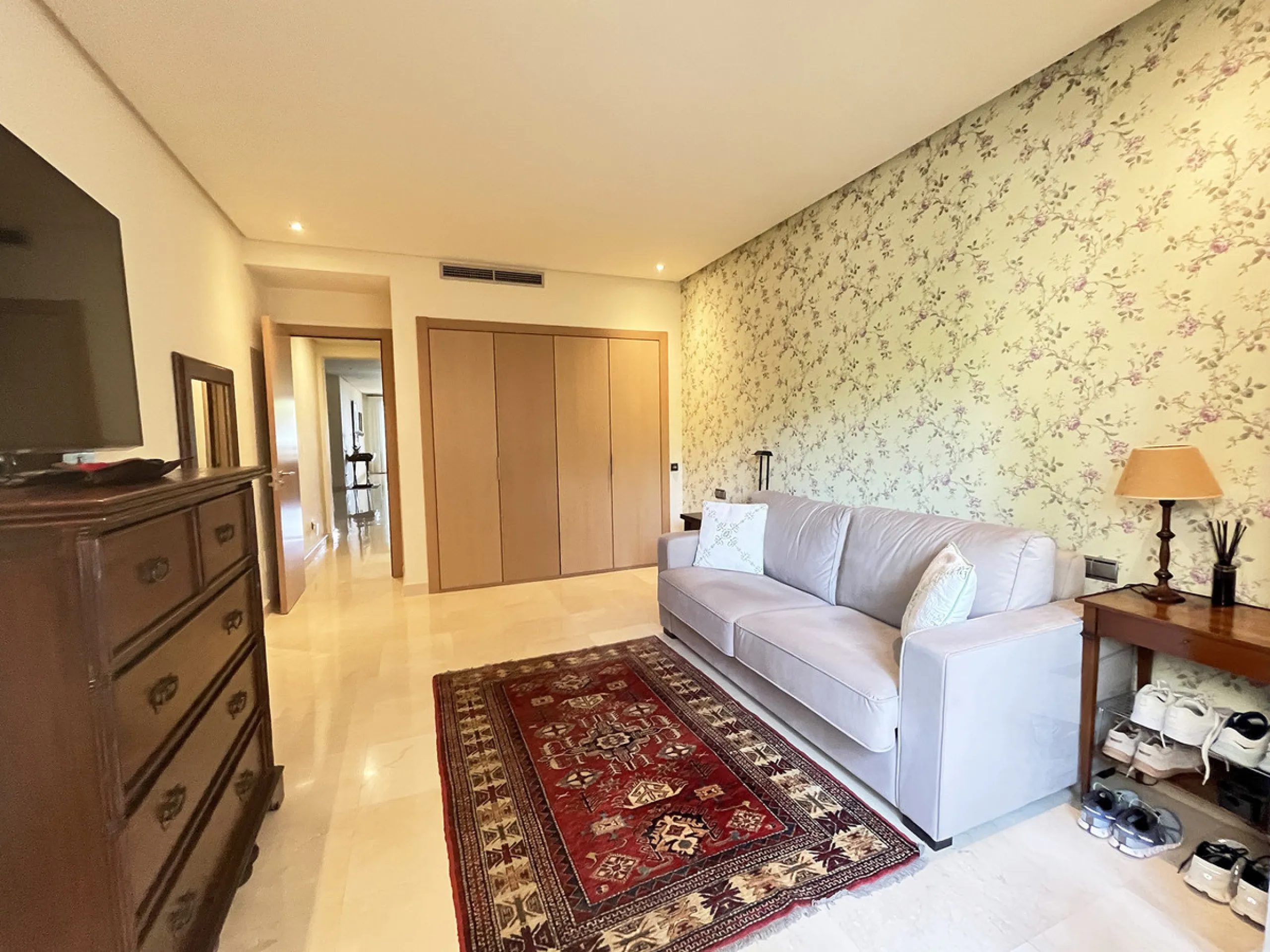 Located within the prestigious gated community Mansion Club, this elegant 2-bedroom, 2-bathroom apartment stands out as one of the finest residential offerings in the area. With a built area of 165 m² and a 41 m² south-facing terrace, it offers generous l