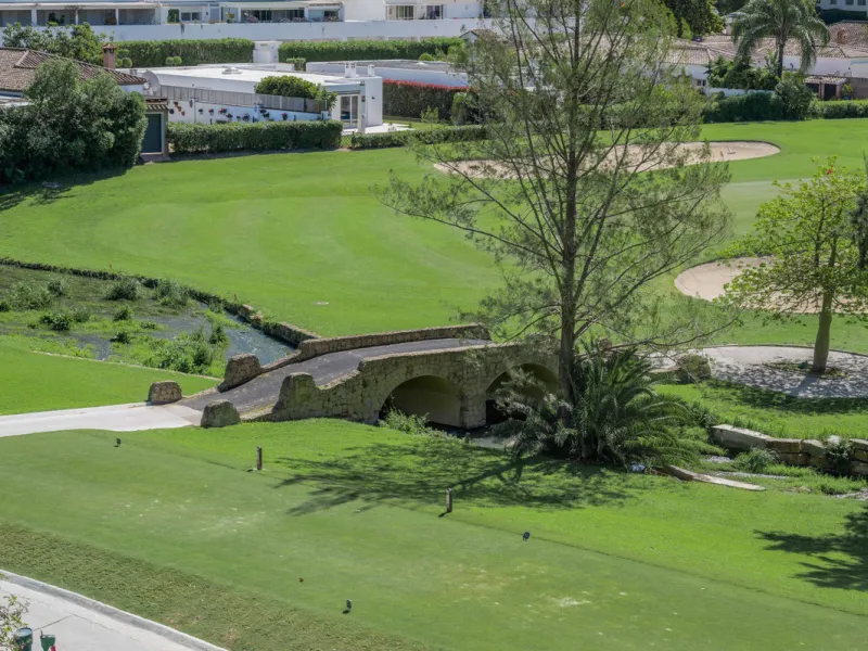 This truly special home combines space, light and tranquility in one of Guadalmina's most sought-after settings. Located on the first floor yet elevated above the golf course, the apartment enjoys the feel of a third floor or penthouse, with uninterrupted