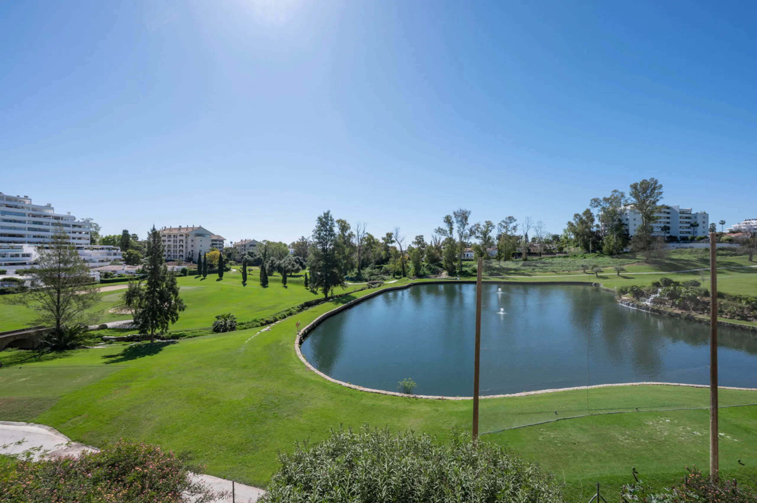 This truly special home combines space, light and tranquility in one of Guadalmina's most sought-after settings. Located on the first floor yet elevated above the golf course, the apartment enjoys the feel of a third floor or penthouse, with uninterrupted