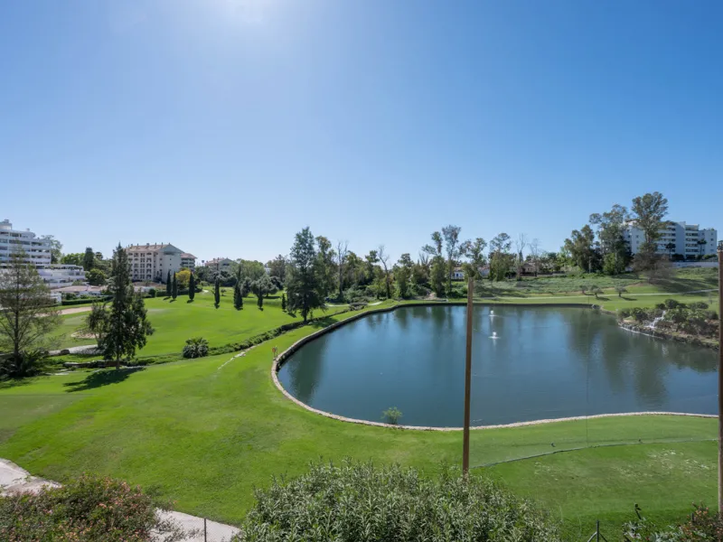 This truly special home combines space, light and tranquility in one of Guadalmina's most sought-after settings. Located on the first floor yet elevated above the golf course, the apartment enjoys the feel of a third floor or penthouse, with uninterrupted