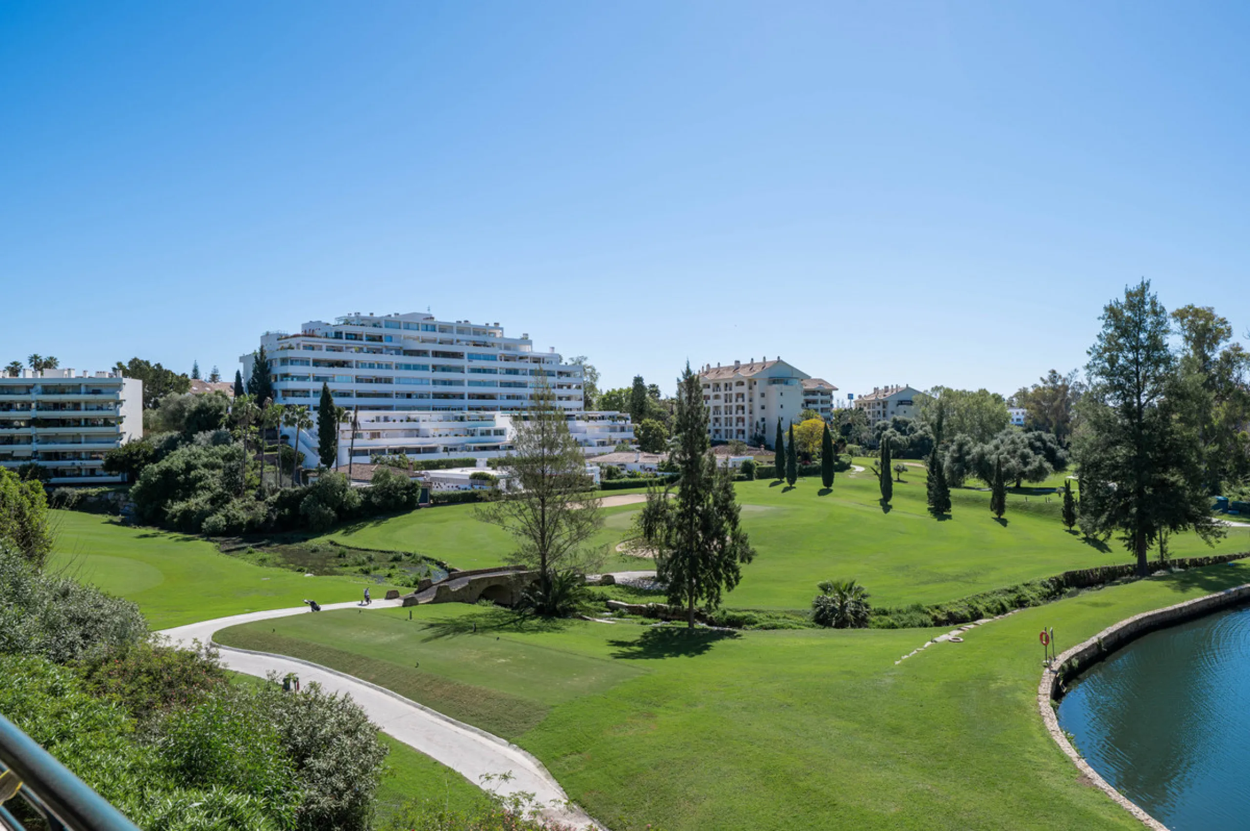 This truly special home combines space, light and tranquility in one of Guadalmina's most sought-after settings. Located on the first floor yet elevated above the golf course, the apartment enjoys the feel of a third floor or penthouse, with uninterrupted