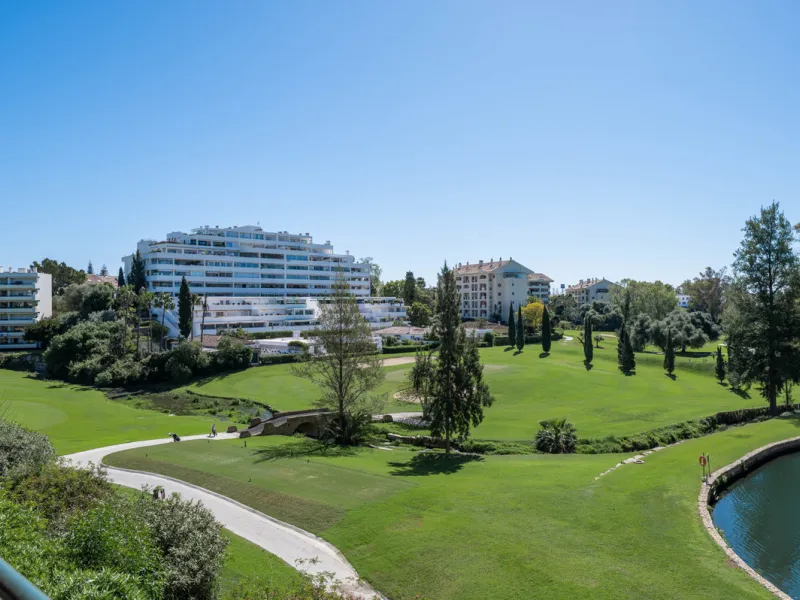This truly special home combines space, light and tranquility in one of Guadalmina's most sought-after settings. Located on the first floor yet elevated above the golf course, the apartment enjoys the feel of a third floor or penthouse, with uninterrupted