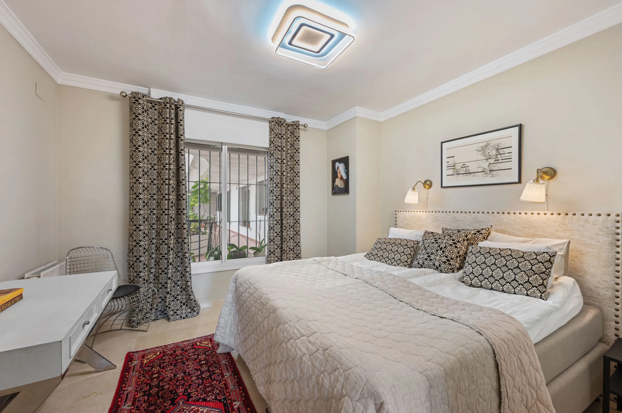 This truly special home combines space, light and tranquility in one of Guadalmina's most sought-after settings. Located on the first floor yet elevated above the golf course, the apartment enjoys the feel of a third floor or penthouse, with uninterrupted