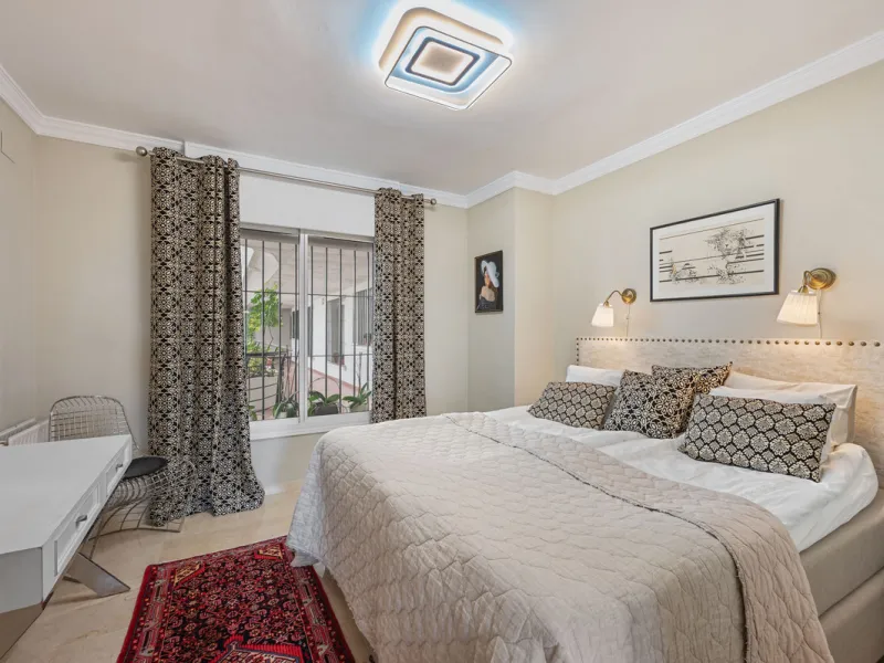 This truly special home combines space, light and tranquility in one of Guadalmina's most sought-after settings. Located on the first floor yet elevated above the golf course, the apartment enjoys the feel of a third floor or penthouse, with uninterrupted