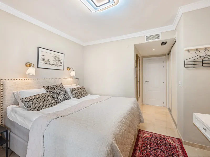 This truly special home combines space, light and tranquility in one of Guadalmina's most sought-after settings. Located on the first floor yet elevated above the golf course, the apartment enjoys the feel of a third floor or penthouse, with uninterrupted