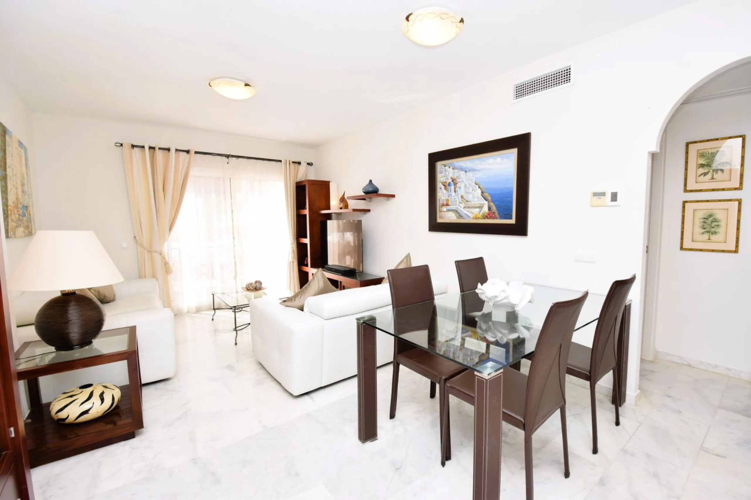This is an immaculately presented penthouse in La Reserva de Marbella just minutes from Cabopino, Elviria and their lovely beaches. This penthouse has a large west facing terrace which offers great winter sun and sea views and upstairs is a huge roof terr