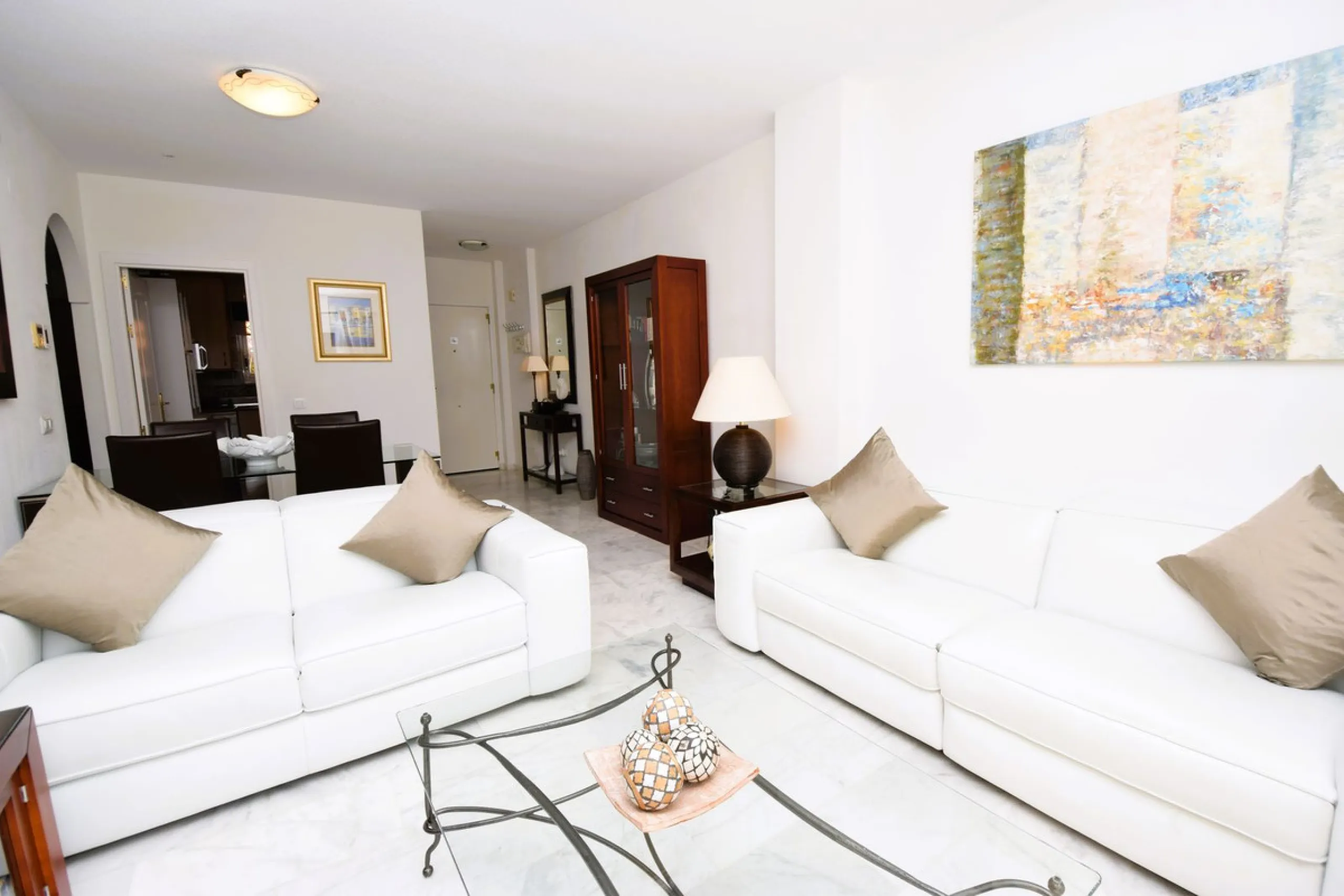 This is an immaculately presented penthouse in La Reserva de Marbella just minutes from Cabopino, Elviria and their lovely beaches. This penthouse has a large west facing terrace which offers great winter sun and sea views and upstairs is a huge roof terr