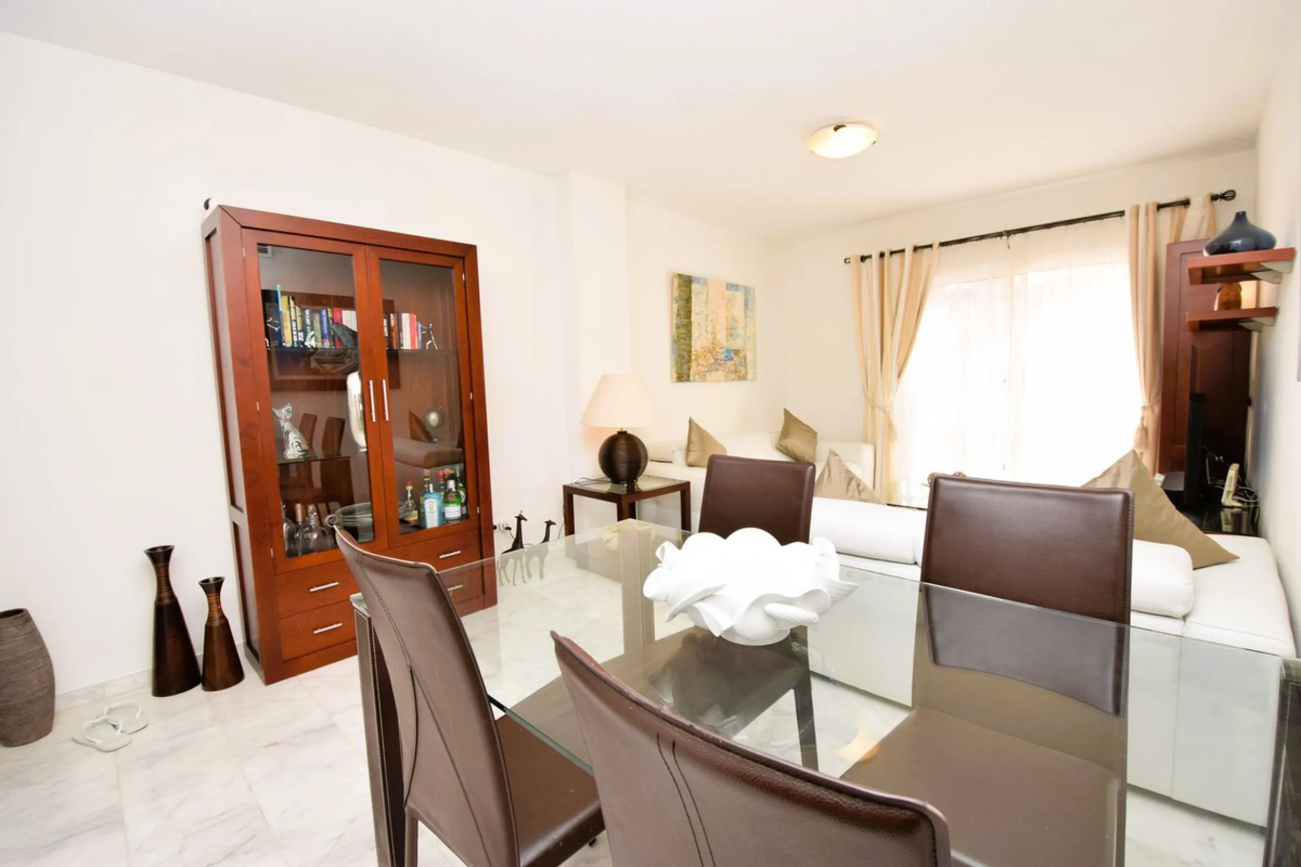 This is an immaculately presented penthouse in La Reserva de Marbella just minutes from Cabopino, Elviria and their lovely beaches. This penthouse has a large west facing terrace which offers great winter sun and sea views and upstairs is a huge roof terr