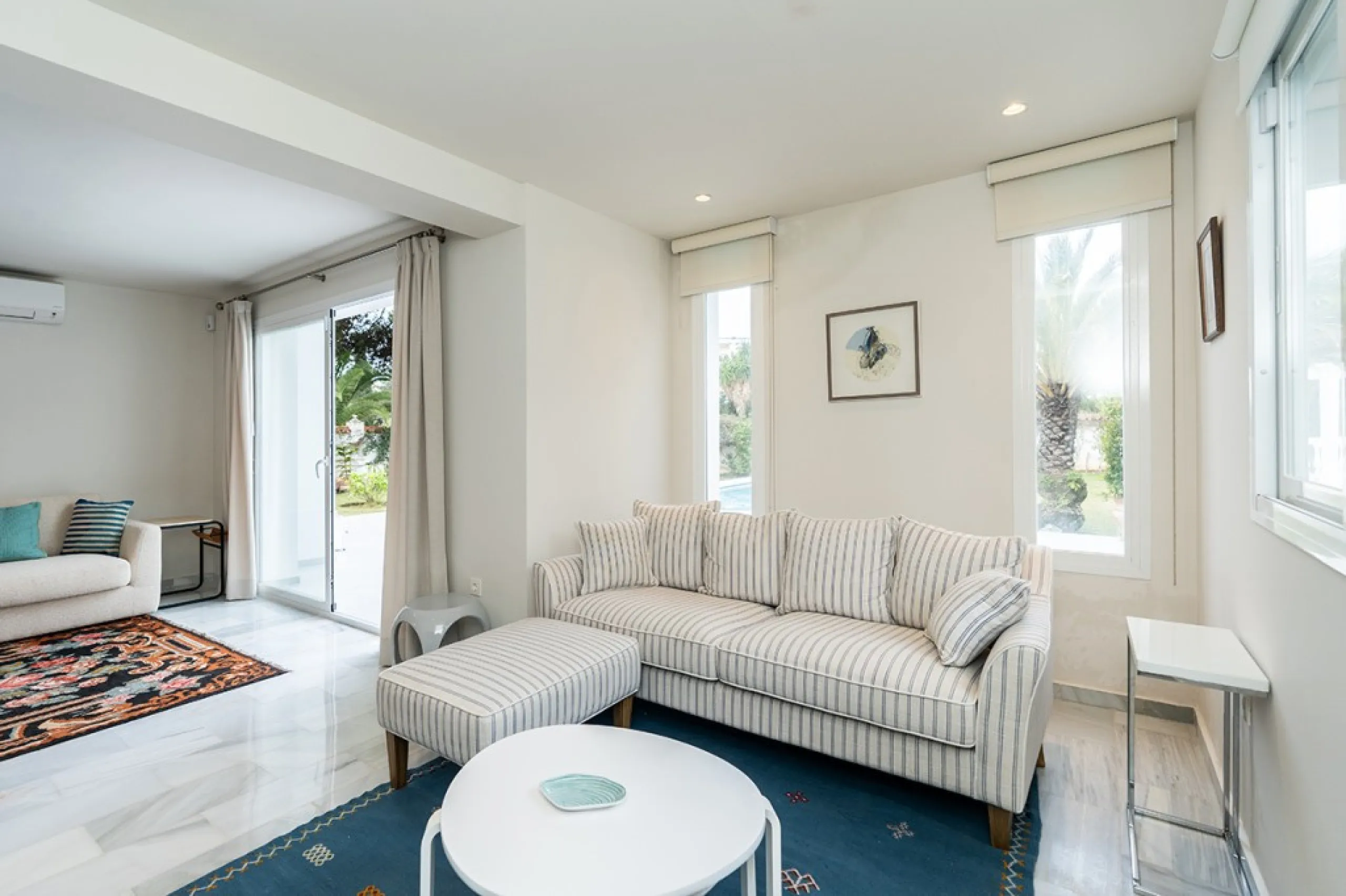 Just 50 metres from the beach, this beautifully renovated and modernised four bedroom, three bathroom villa is set on a spacious, flat plot featuring a large swimming pool and lush mature garden. The property boasts a fully upgraded kitchen and bathrooms,