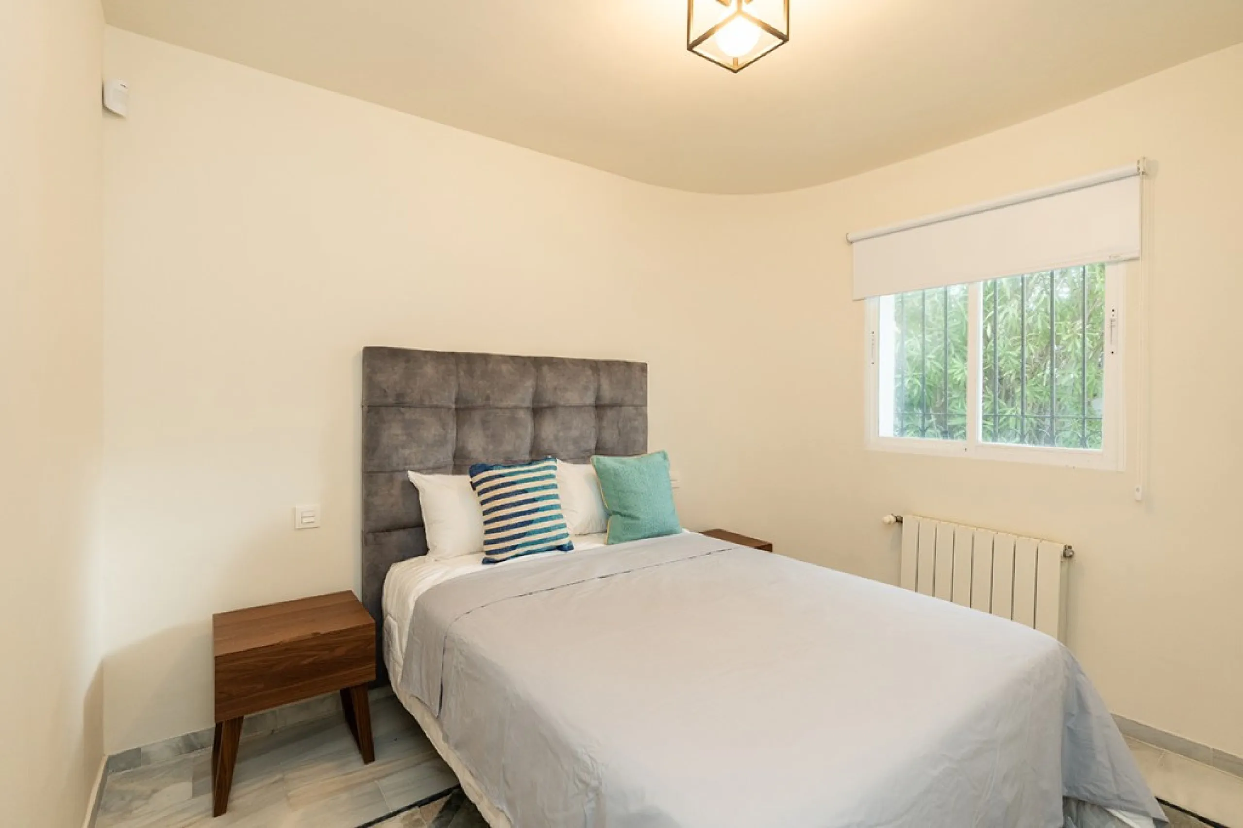 Just 50 metres from the beach, this beautifully renovated and modernised four bedroom, three bathroom villa is set on a spacious, flat plot featuring a large swimming pool and lush mature garden. The property boasts a fully upgraded kitchen and bathrooms,