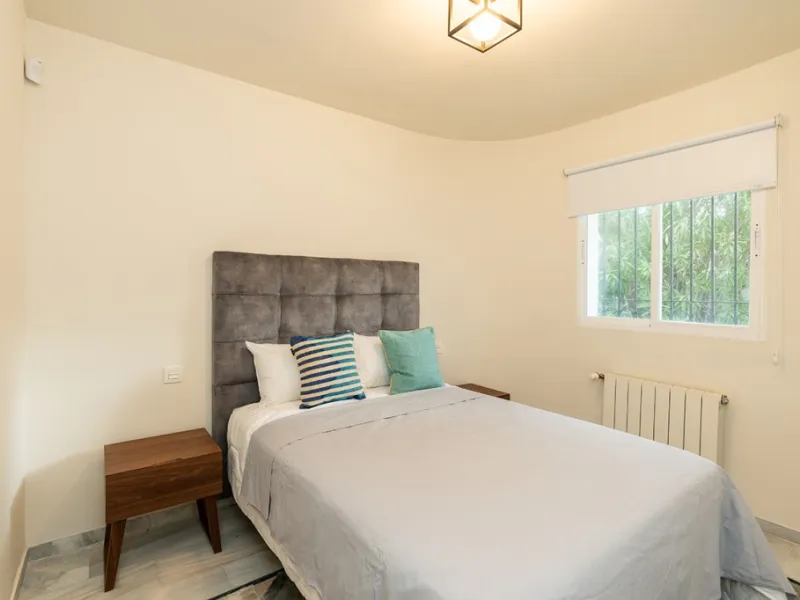 Just 50 metres from the beach, this beautifully renovated and modernised four bedroom, three bathroom villa is set on a spacious, flat plot featuring a large swimming pool and lush mature garden. The property boasts a fully upgraded kitchen and bathrooms,
