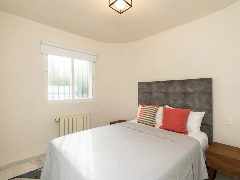 Just 50 metres from the beach, this beautifully renovated and modernised four bedroom, three bathroom villa is set on a spacious, flat plot featuring a large swimming pool and lush mature garden. The property boasts a fully upgraded kitchen and bathrooms,
