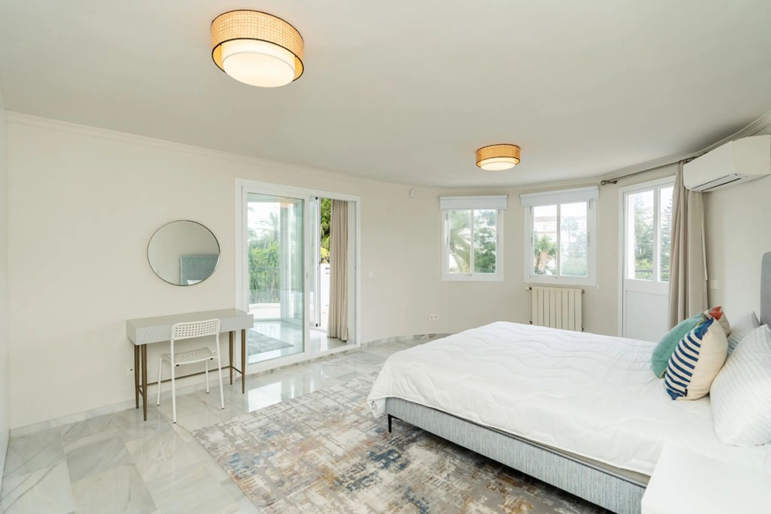 Just 50 metres from the beach, this beautifully renovated and modernised four bedroom, three bathroom villa is set on a spacious, flat plot featuring a large swimming pool and lush mature garden. The property boasts a fully upgraded kitchen and bathrooms,