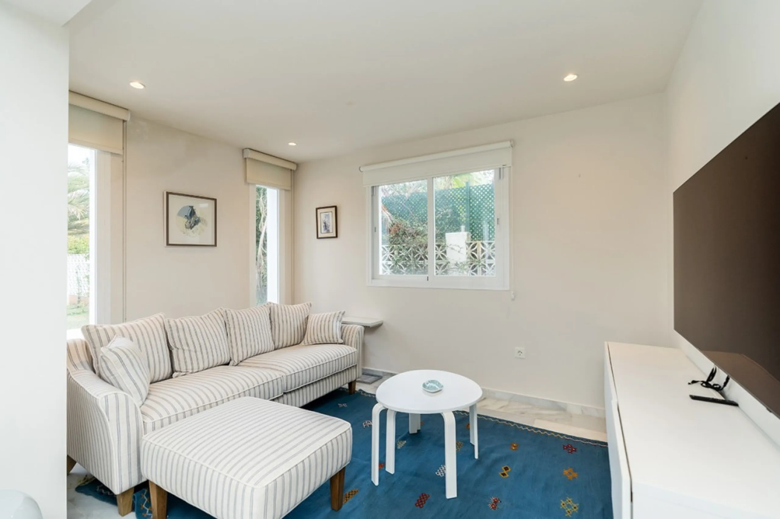 Just 50 metres from the beach, this beautifully renovated and modernised four bedroom, three bathroom villa is set on a spacious, flat plot featuring a large swimming pool and lush mature garden. The property boasts a fully upgraded kitchen and bathrooms,