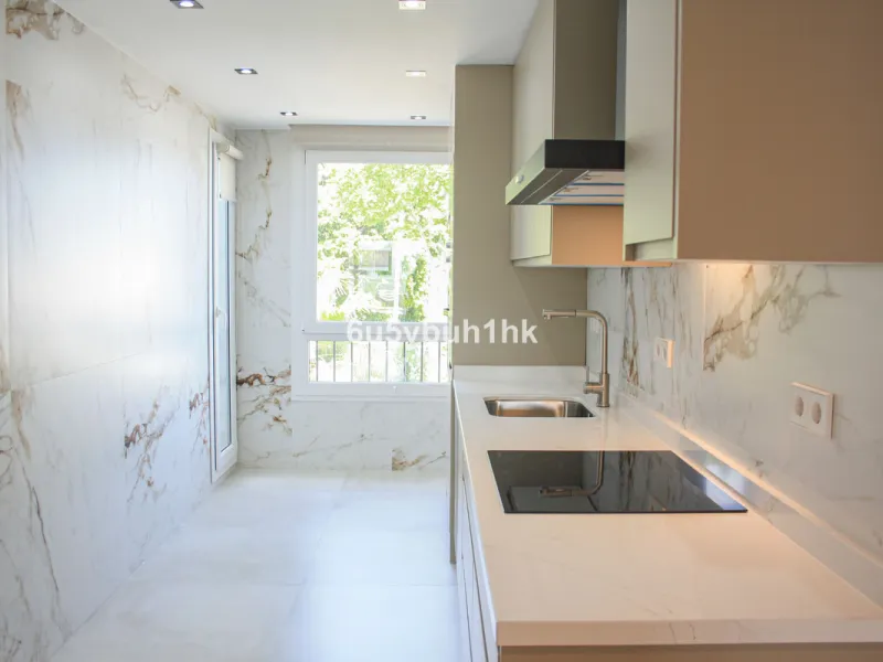 Located on Marbella's prestigious Golden Mile, this refined apartment in Las Cañas Beach perfectly balances timeless elegance with the comfort of a true home. Recently renovated and thoughtfully furnished with premium materials, it's offered exactly as it