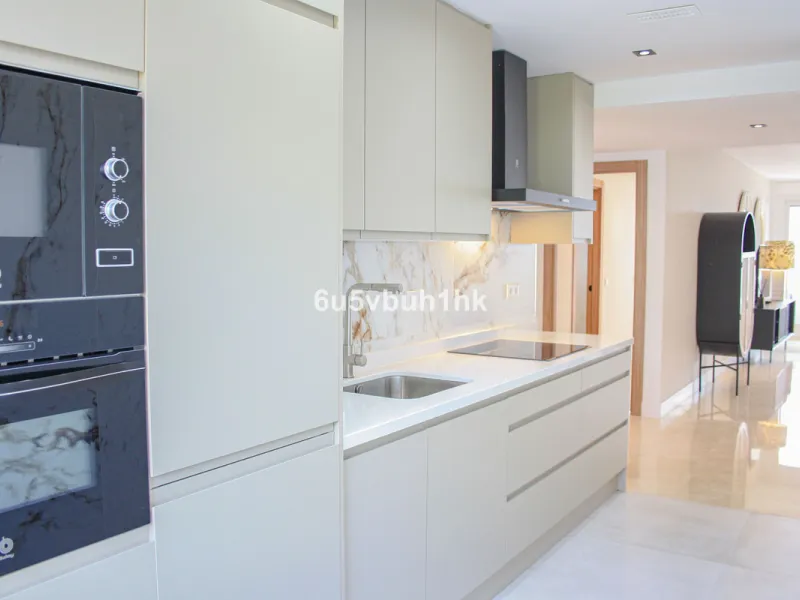 Located on Marbella's prestigious Golden Mile, this refined apartment in Las Cañas Beach perfectly balances timeless elegance with the comfort of a true home. Recently renovated and thoughtfully furnished with premium materials, it's offered exactly as it