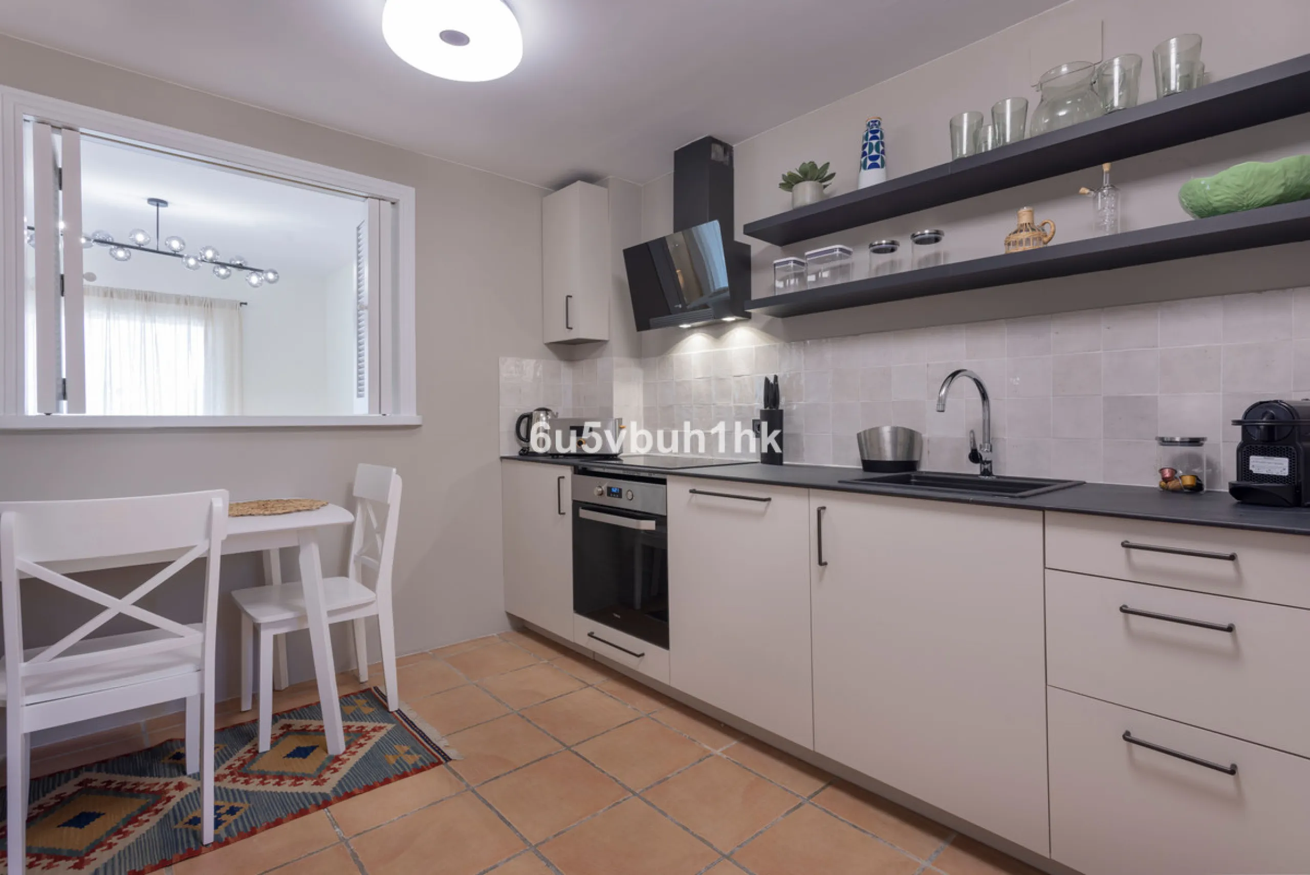 Fully renovated and beautifully presented, this home immediately impresses with a welcoming entrance hall that leads to a spacious, separate kitchen with an adjoining laundry area. From here, you step into a bright and airy open-plan living and dining spa