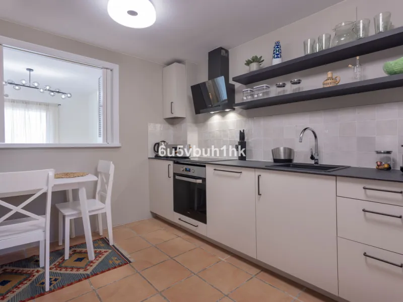 Fully renovated and beautifully presented, this home immediately impresses with a welcoming entrance hall that leads to a spacious, separate kitchen with an adjoining laundry area. From here, you step into a bright and airy open-plan living and dining spa