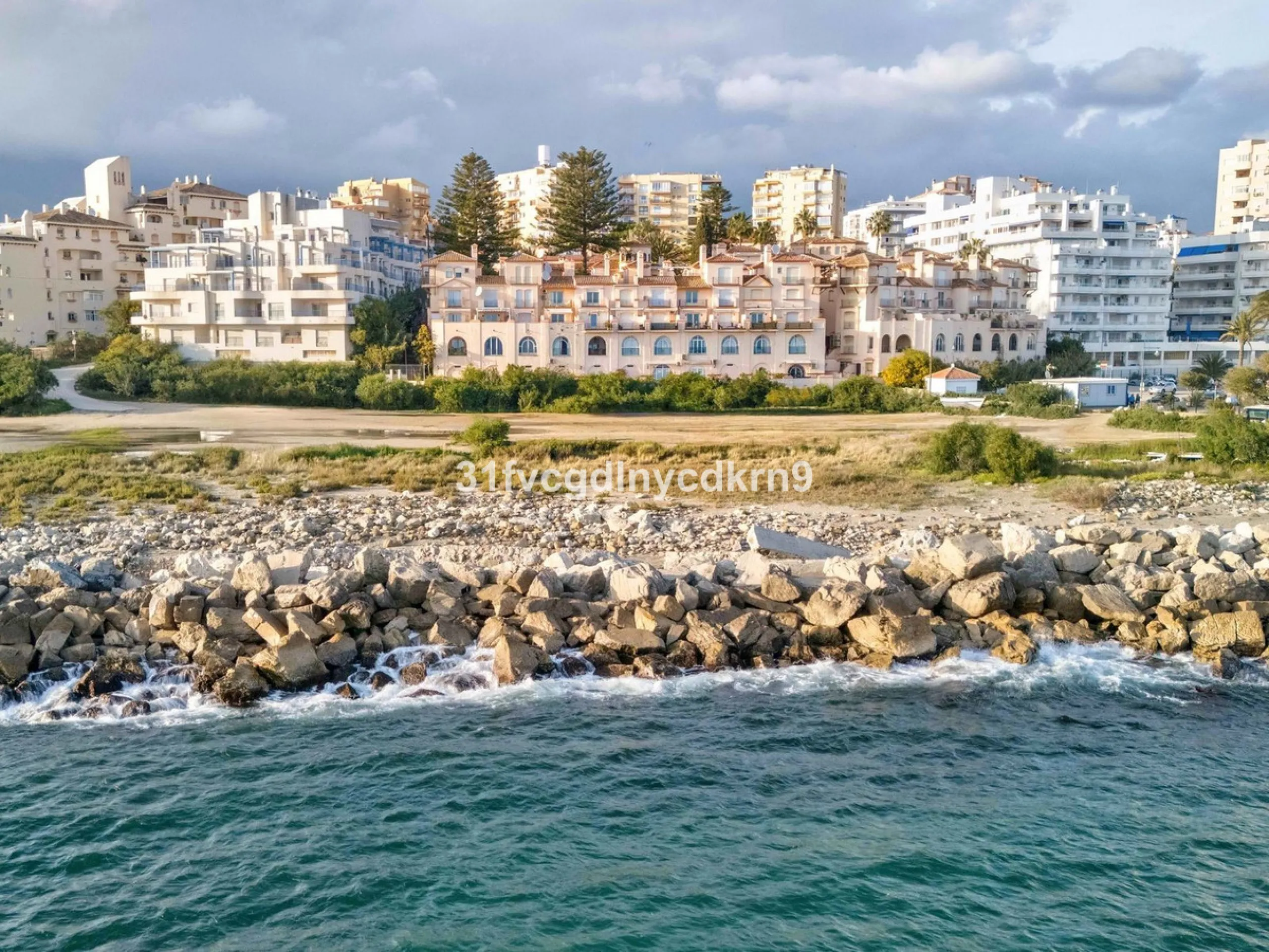 Presenting an exceptional duplex sanctuary nestled within the prestigious Belgravia complex, mere steps from Estepona's vibrant harbor and sun-kissed shores. Originally conceived as separate ground-floor and mezzanine units, this residence has been master
