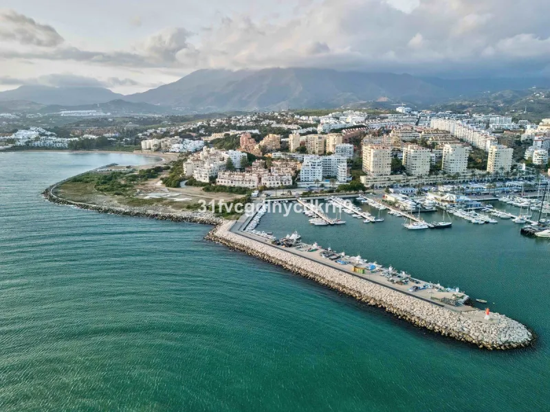 Presenting an exceptional duplex sanctuary nestled within the prestigious Belgravia complex, mere steps from Estepona's vibrant harbor and sun-kissed shores. Originally conceived as separate ground-floor and mezzanine units, this residence has been master