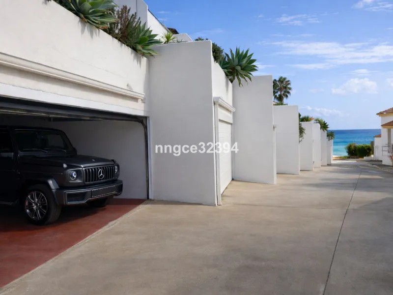 Spacious Seaview Beachfront Townhouse with Attached Multicar Garage, Solarium, and Versatile Bonus Rooms