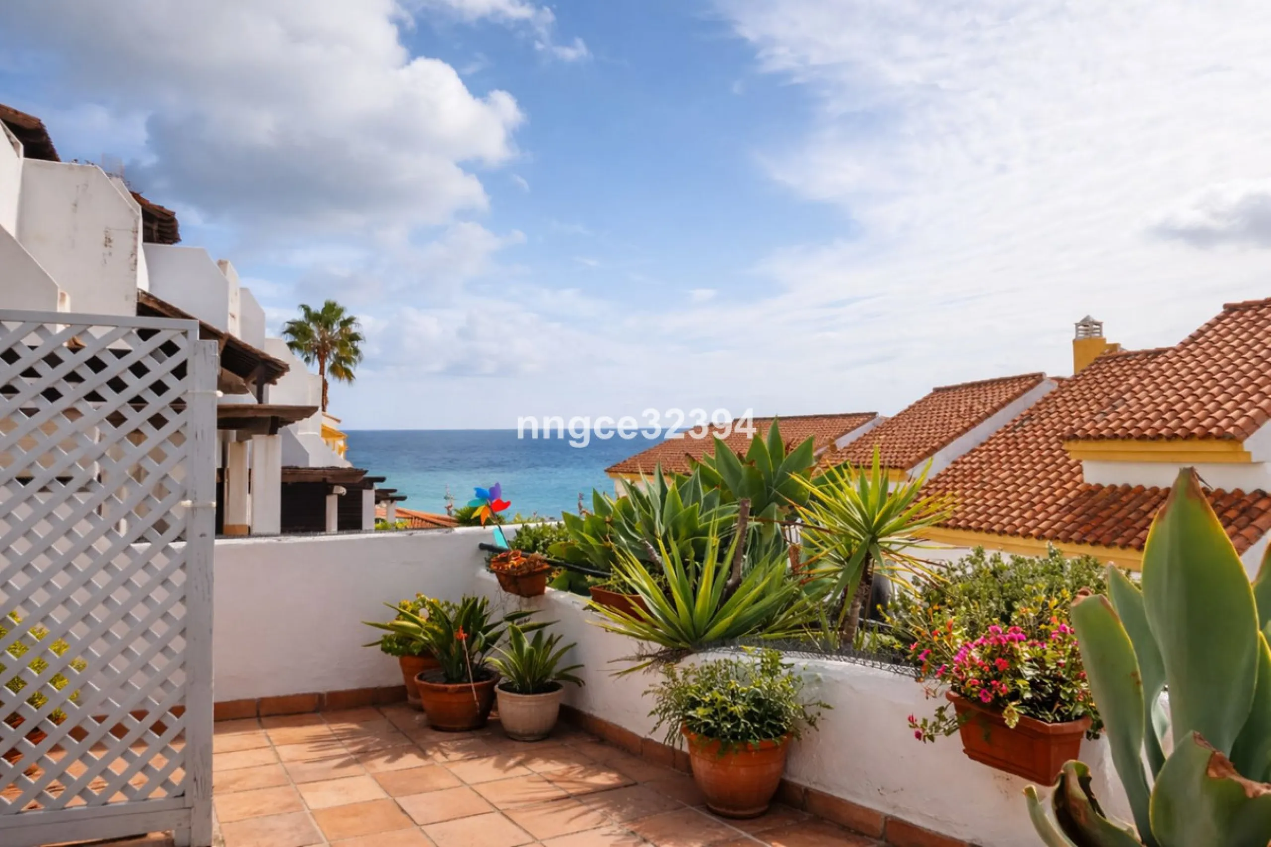 Spacious Seaview Beachfront Townhouse with Attached Multicar Garage, Solarium, and Versatile Bonus Rooms