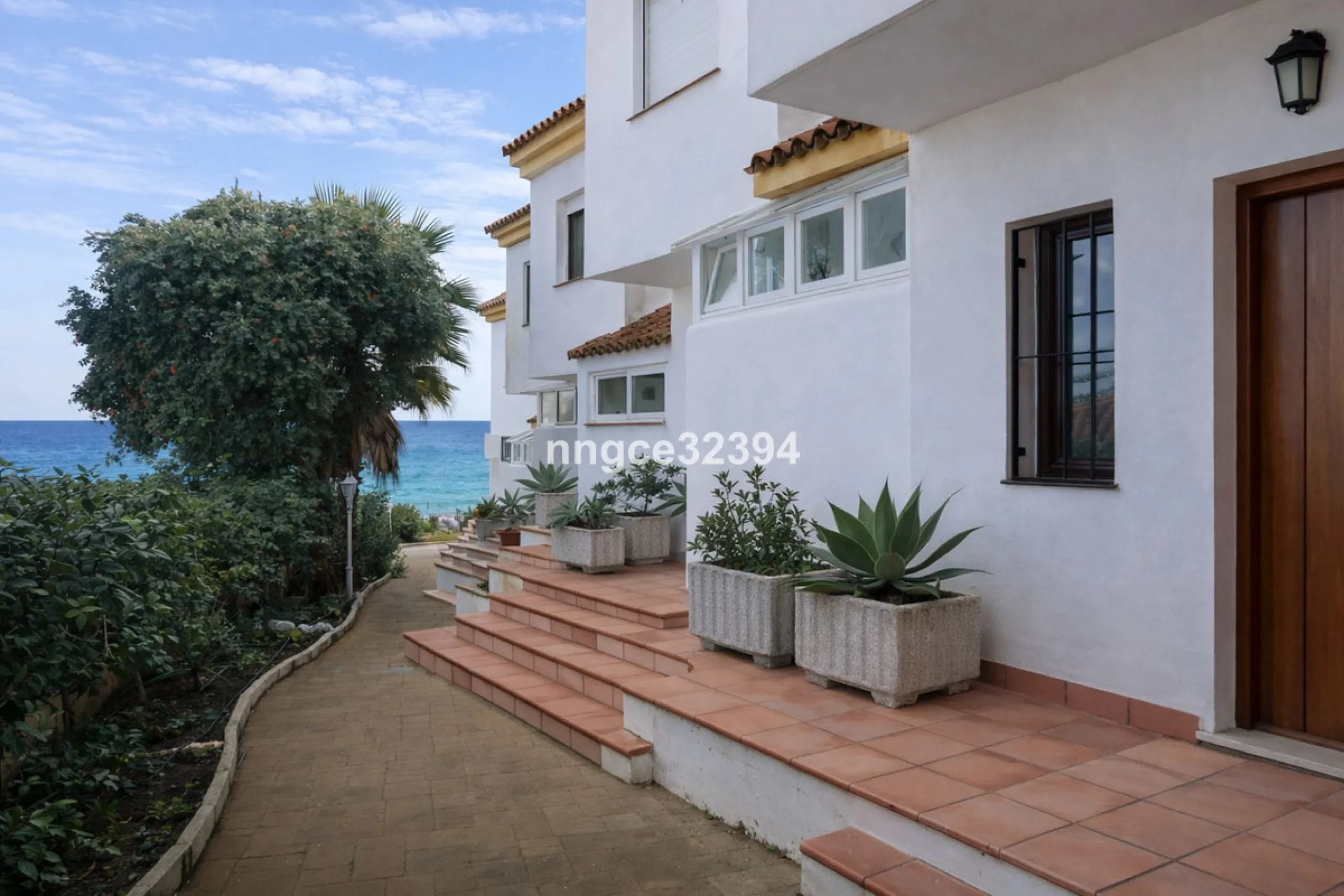 Spacious Seaview Beachfront Townhouse with Attached Multicar Garage, Solarium, and Versatile Bonus Rooms