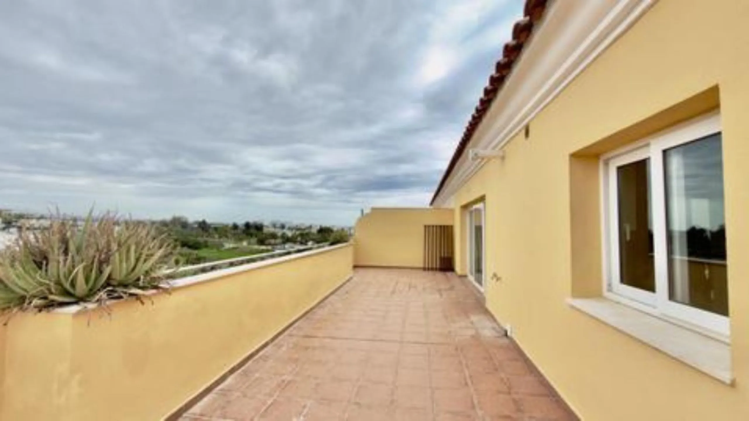 Exclusive penthouse for sale in Cancelada, Estepona, ideal for those seeking to enjoy the Costa del Sol lifestyle with generous outdoor space and a privileged location. The property stands out for its impressive terrace of approximately 80 m² with open vi