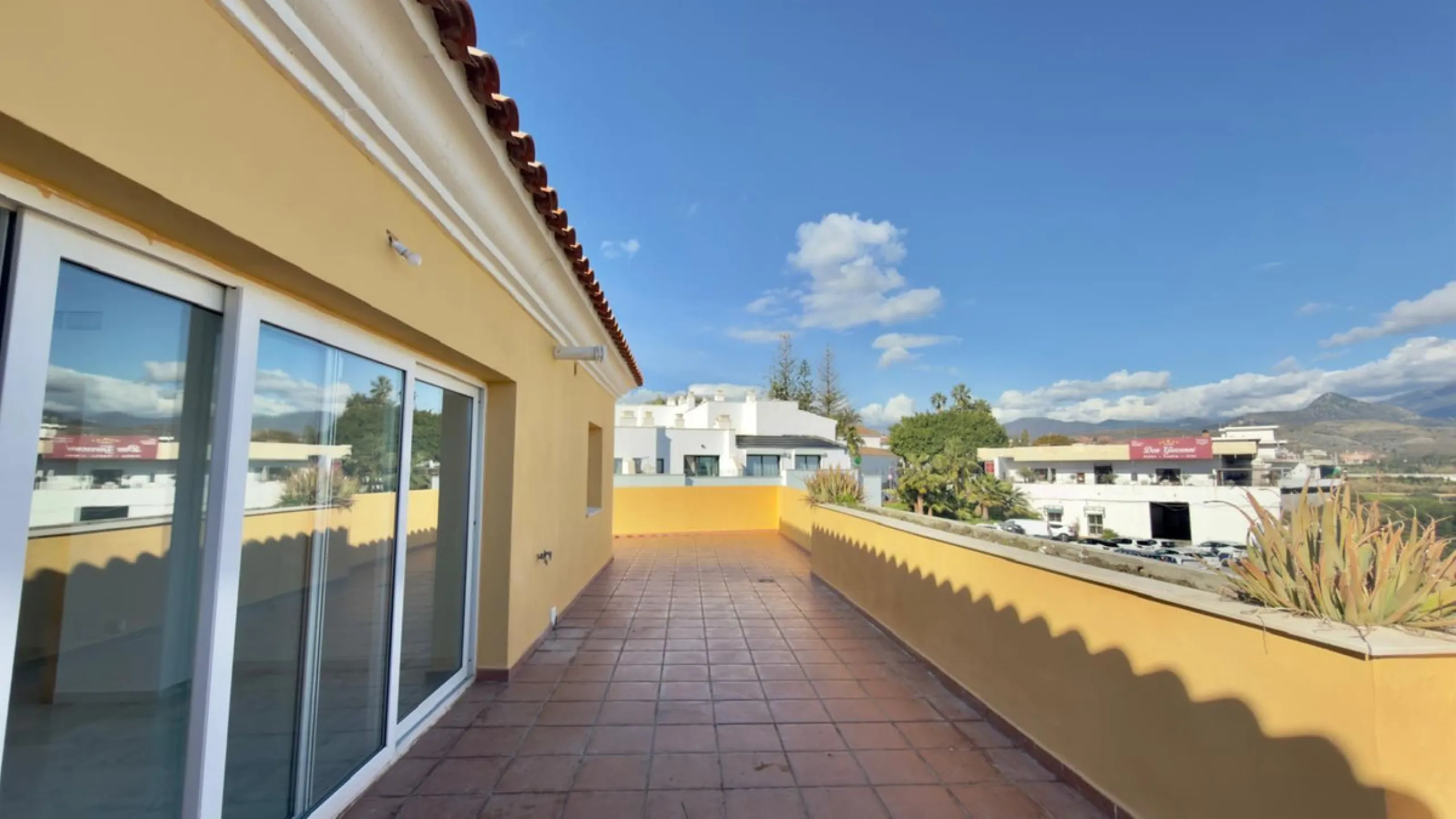 Exclusive penthouse for sale in Cancelada, Estepona, ideal for those seeking to enjoy the Costa del Sol lifestyle with generous outdoor space and a privileged location. The property stands out for its impressive terrace of approximately 80 m² with open vi
