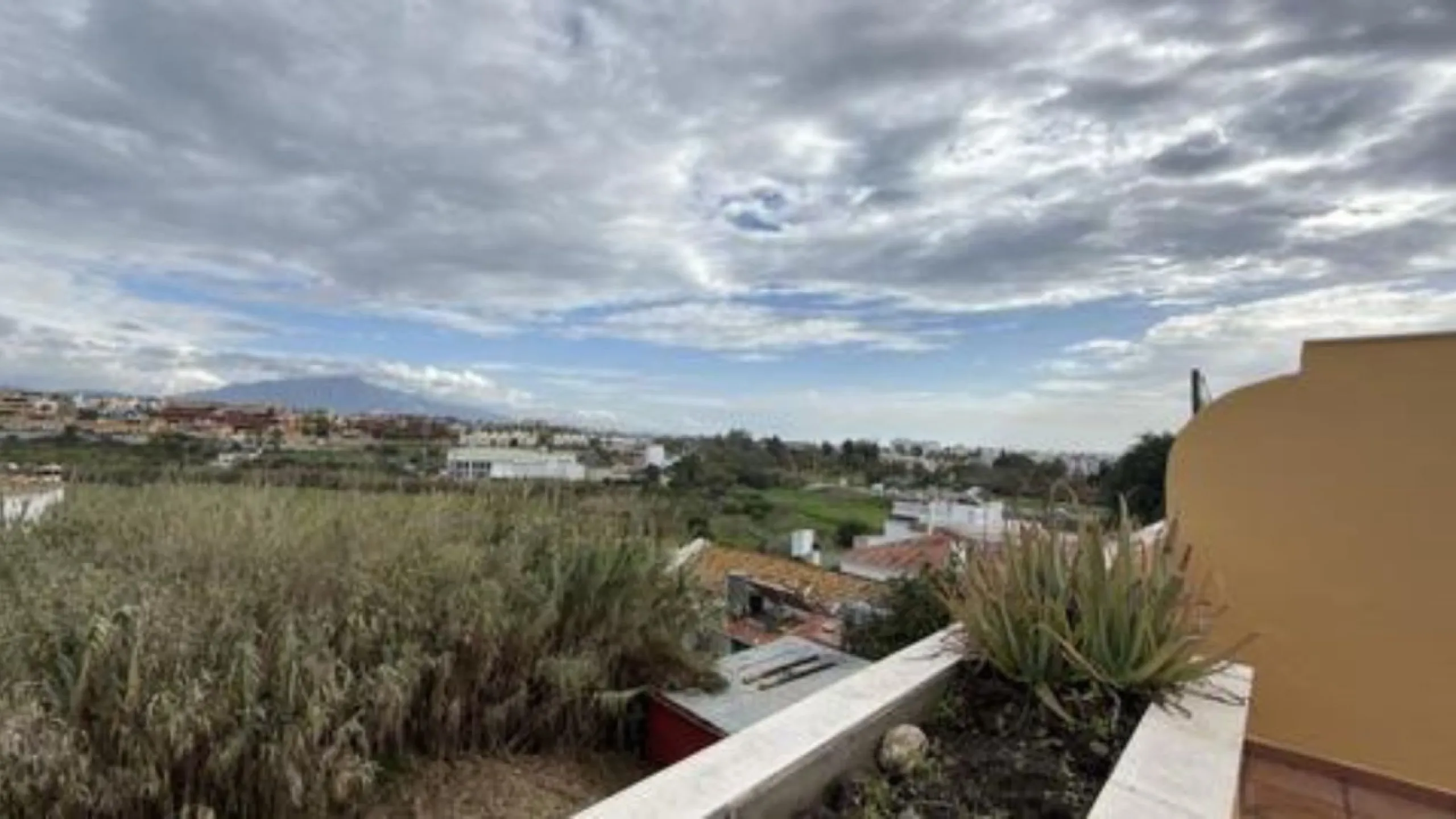 Exclusive penthouse for sale in Cancelada, Estepona, ideal for those seeking to enjoy the Costa del Sol lifestyle with generous outdoor space and a privileged location. The property stands out for its impressive terrace of approximately 80 m² with open vi