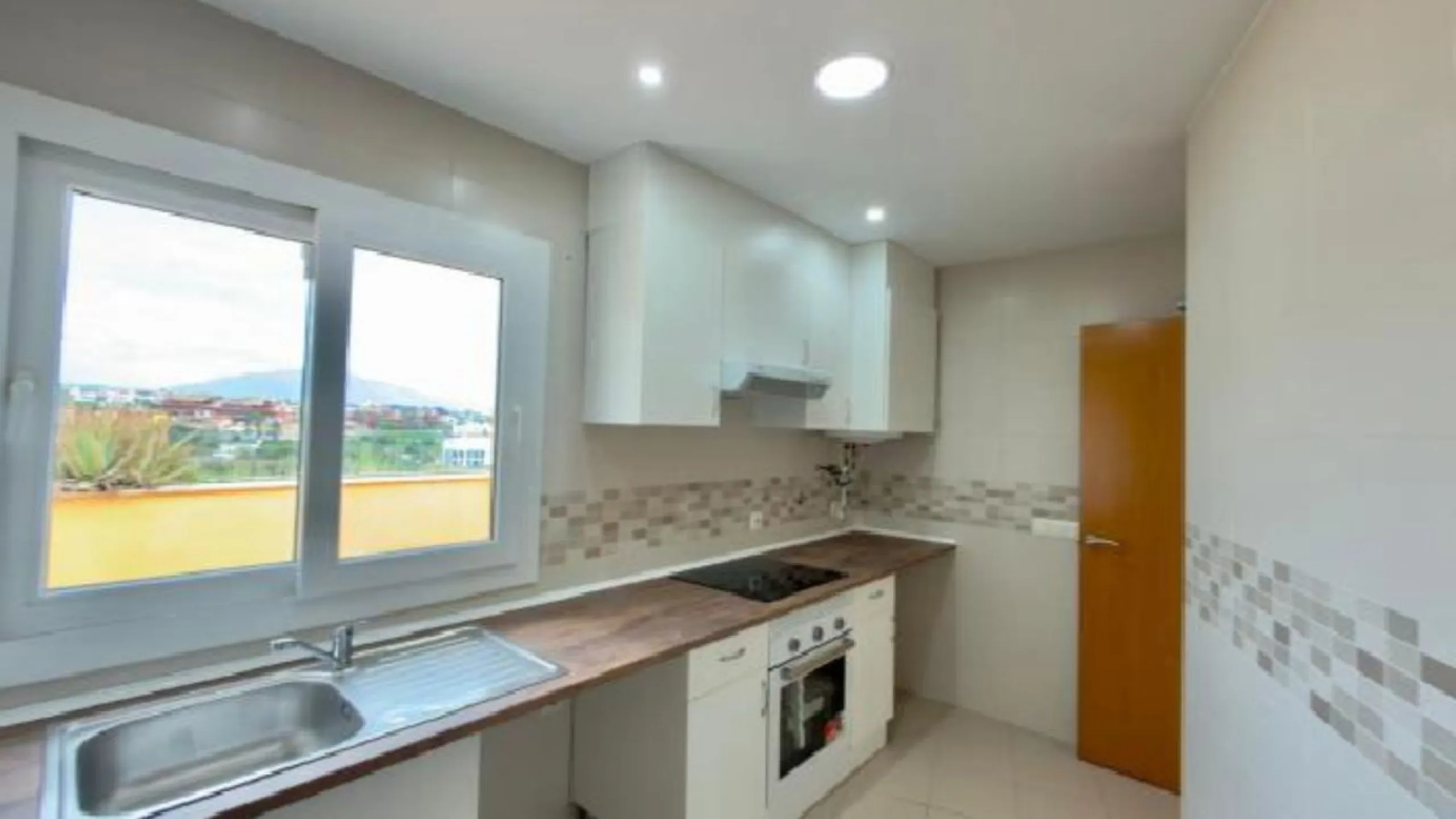 Exclusive penthouse for sale in Cancelada, Estepona, ideal for those seeking to enjoy the Costa del Sol lifestyle with generous outdoor space and a privileged location. The property stands out for its impressive terrace of approximately 80 m² with open vi