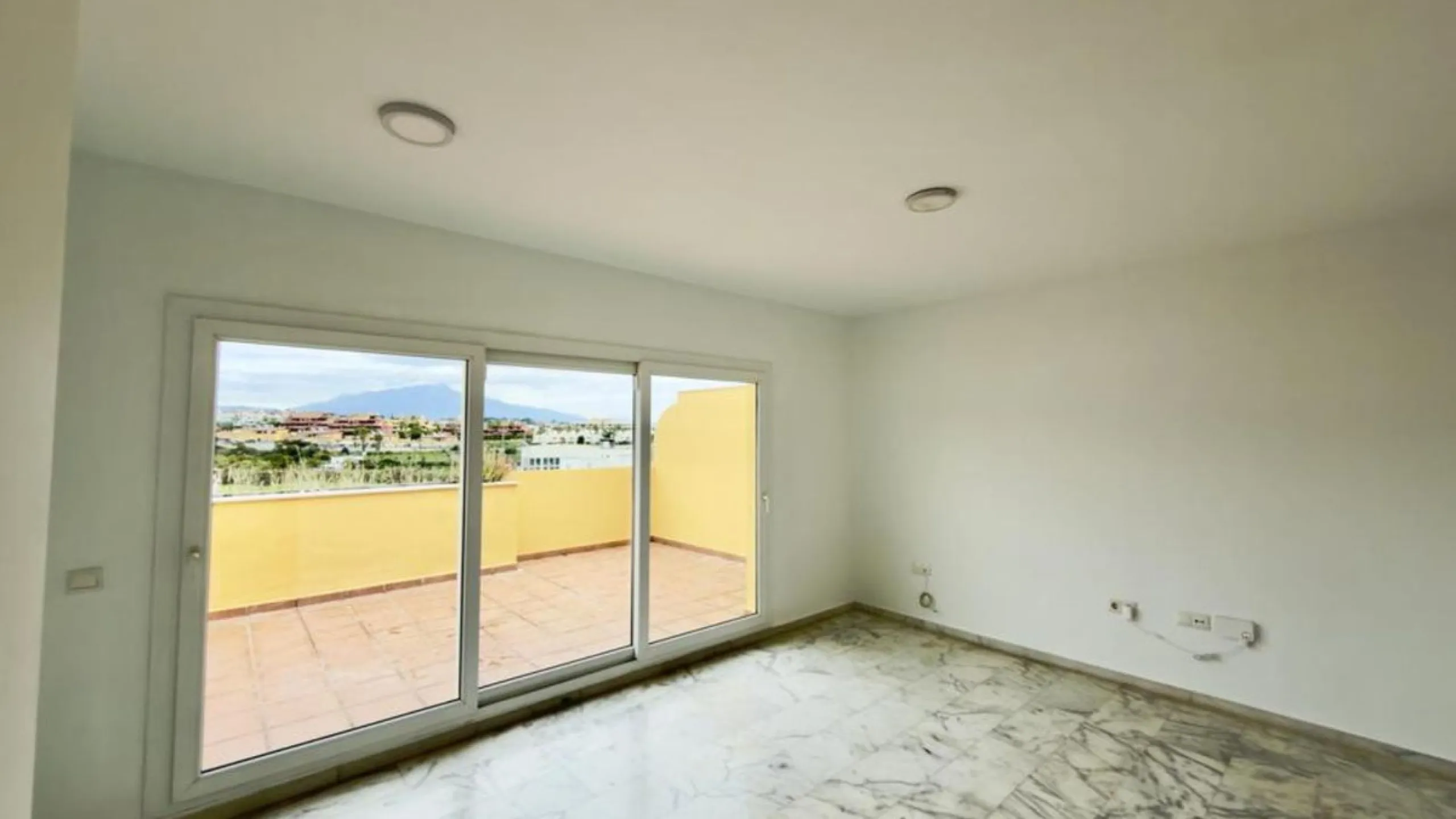 Exclusive penthouse for sale in Cancelada, Estepona, ideal for those seeking to enjoy the Costa del Sol lifestyle with generous outdoor space and a privileged location. The property stands out for its impressive terrace of approximately 80 m² with open vi