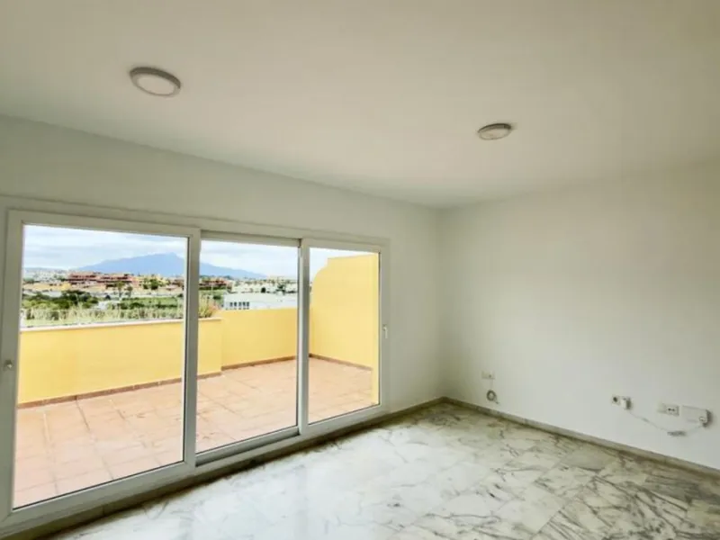 Exclusive penthouse for sale in Cancelada, Estepona, ideal for those seeking to enjoy the Costa del Sol lifestyle with generous outdoor space and a privileged location. The property stands out for its impressive terrace of approximately 80 m² with open vi