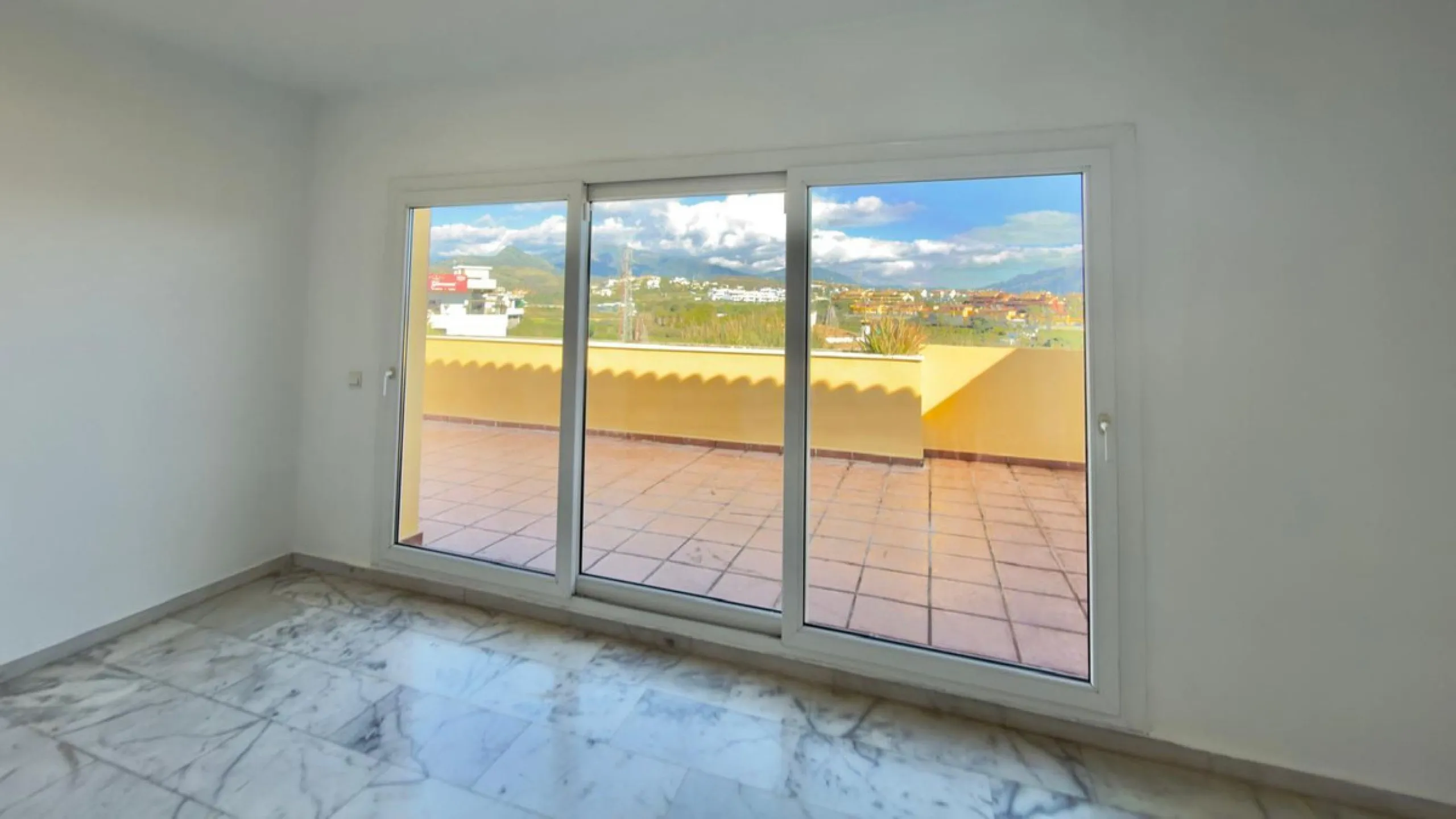 Exclusive penthouse for sale in Cancelada, Estepona, ideal for those seeking to enjoy the Costa del Sol lifestyle with generous outdoor space and a privileged location. The property stands out for its impressive terrace of approximately 80 m² with open vi