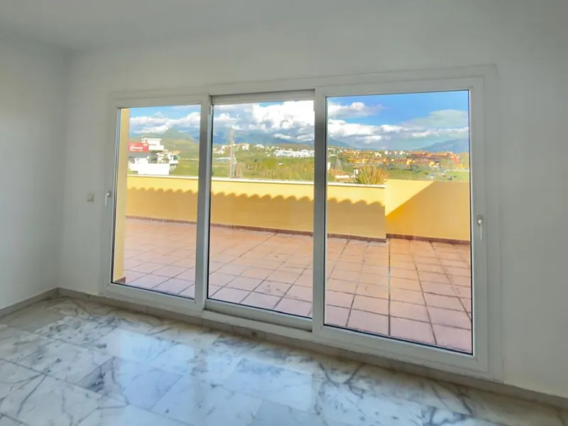 Exclusive penthouse for sale in Cancelada, Estepona, ideal for those seeking to enjoy the Costa del Sol lifestyle with generous outdoor space and a privileged location. The property stands out for its impressive terrace of approximately 80 m² with open vi