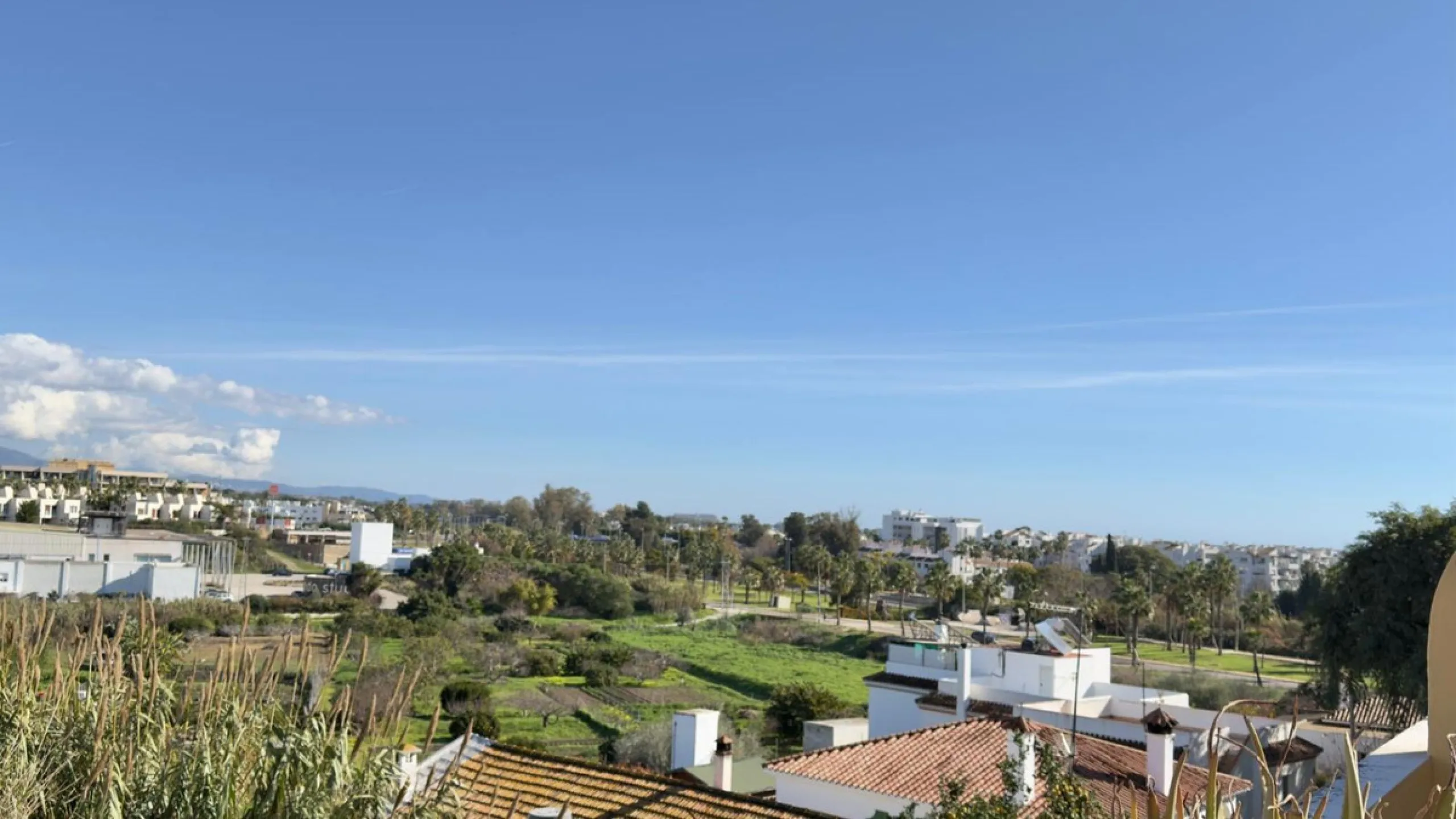Exclusive penthouse for sale in Cancelada, Estepona, ideal for those seeking to enjoy the Costa del Sol lifestyle with generous outdoor space and a privileged location. The property stands out for its impressive terrace of approximately 80 m² with open vi