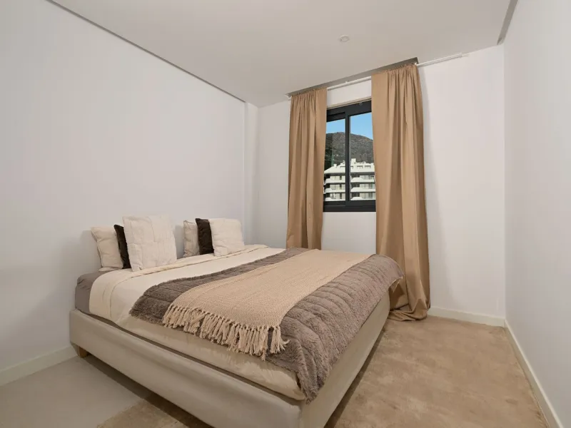 This modern apartment is situated in the sought-after area of El Higueron, Fuengirola, Malaga, offering a blend of comfort, style, and convenience. Boasting two spacious bedrooms and two bathrooms, including a luxurious en-suite, the property provides an 
