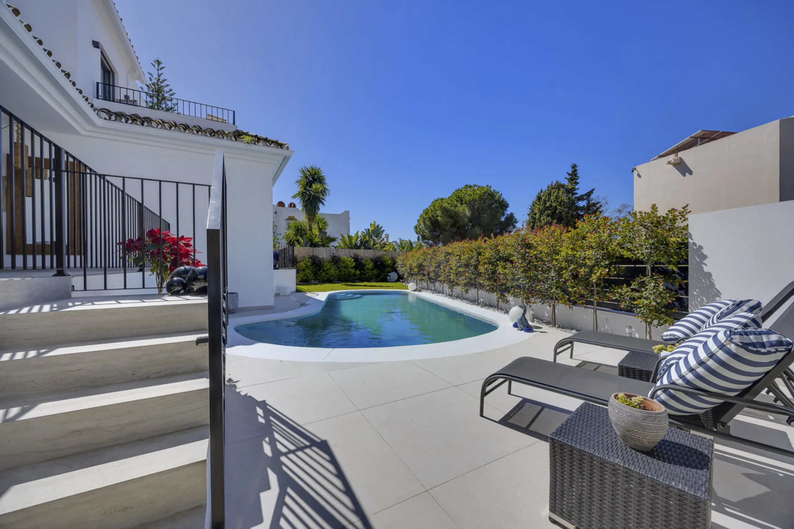 Discover this exceptional southwest-facing villa, a stunning blend of contemporary elegance and modern comfort. Recently refurbished with top-quality materials, this exquisite home boasts a sleek design that perfectly complements its surroundings. Located