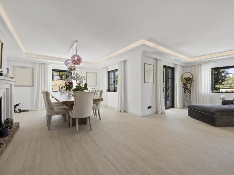 Discover this exceptional southwest-facing villa, a stunning blend of contemporary elegance and modern comfort. Recently refurbished with top-quality materials, this exquisite home boasts a sleek design that perfectly complements its surroundings. Located