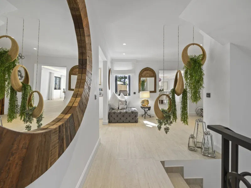 Discover this exceptional southwest-facing villa, a stunning blend of contemporary elegance and modern comfort. Recently refurbished with top-quality materials, this exquisite home boasts a sleek design that perfectly complements its surroundings. Located