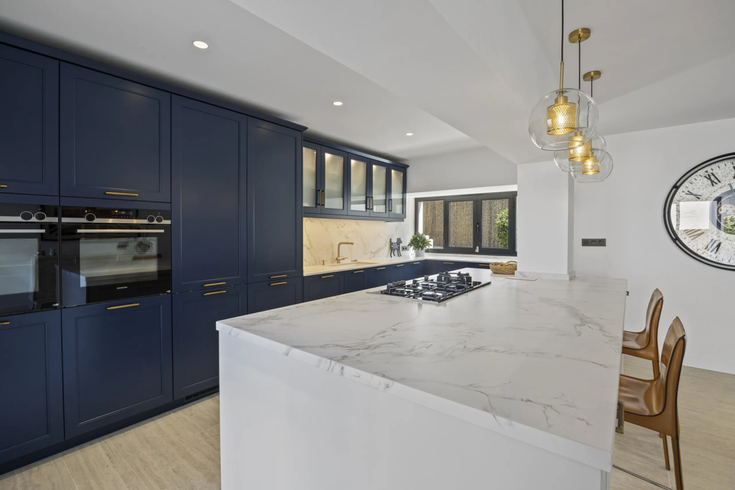Discover this exceptional southwest-facing villa, a stunning blend of contemporary elegance and modern comfort. Recently refurbished with top-quality materials, this exquisite home boasts a sleek design that perfectly complements its surroundings. Located