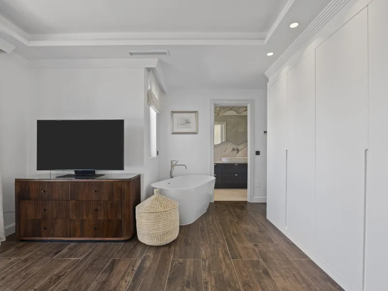 Discover this exceptional southwest-facing villa, a stunning blend of contemporary elegance and modern comfort. Recently refurbished with top-quality materials, this exquisite home boasts a sleek design that perfectly complements its surroundings. Located